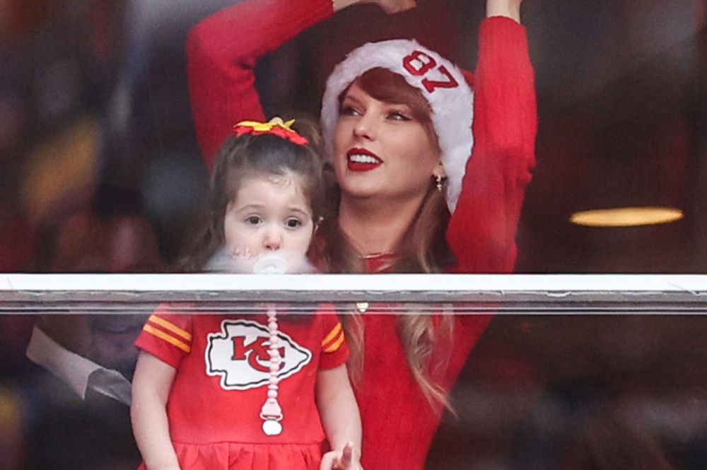 Taylor Swift Has Cute Moment with Mystery Kid in Chiefs Suite on Christmas