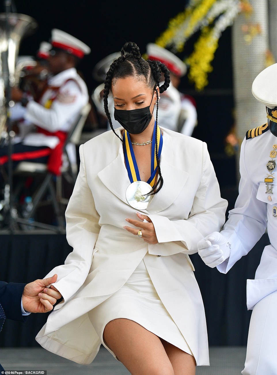 Safety first: Amid the ongoing coronavirus pandemic, the star covered up in a black face mask, while her raven locks were styled into chic chunky plaits