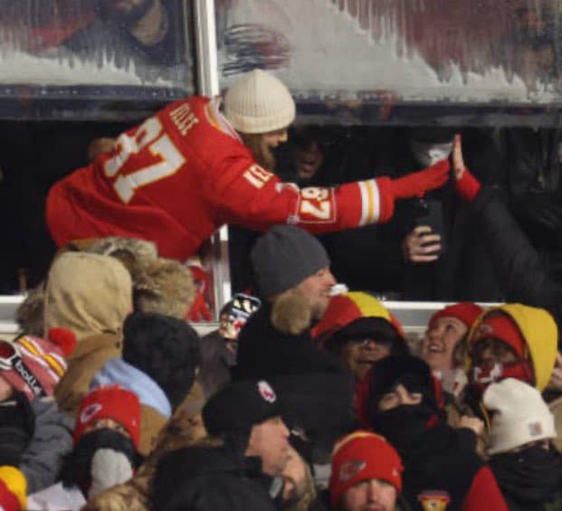 May be an image of 2 people, people playing football, crowd and text