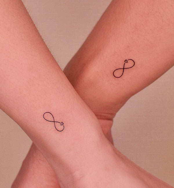 Matching infinity tattoos by @tattooer_jina