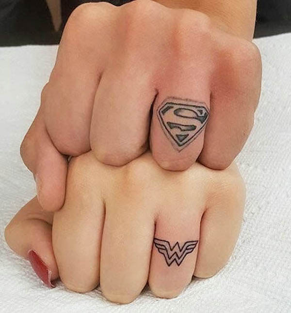 Superman and Wonder Woman tattoos by @snowbaby_jt