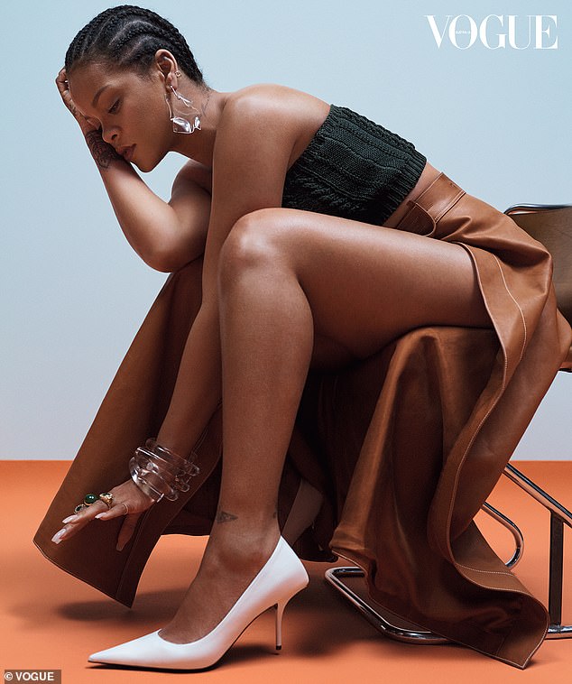 From every angle: A third photo sees the activist sitting on the edge of a chair in a knitted bandeau top and high-waisted tan leather skirt