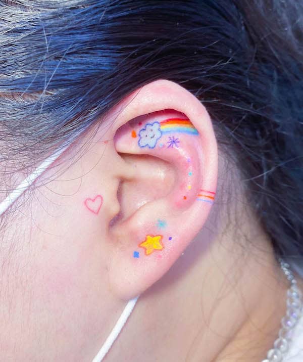 Rainbow ear tattoo by @kiran_stardust