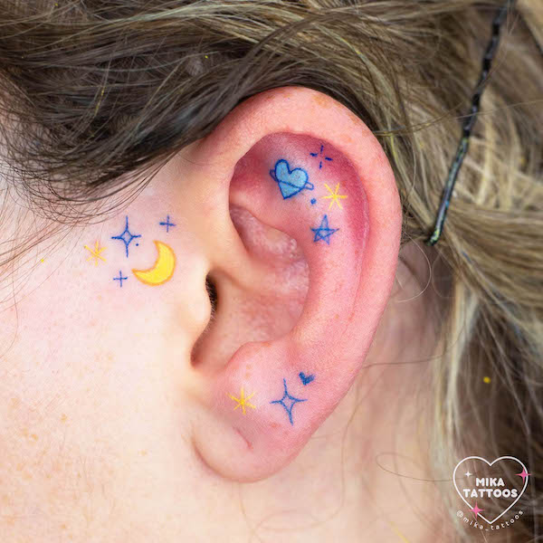 Cute and dreamy cosmic ear tattoo by @mika_tattoos