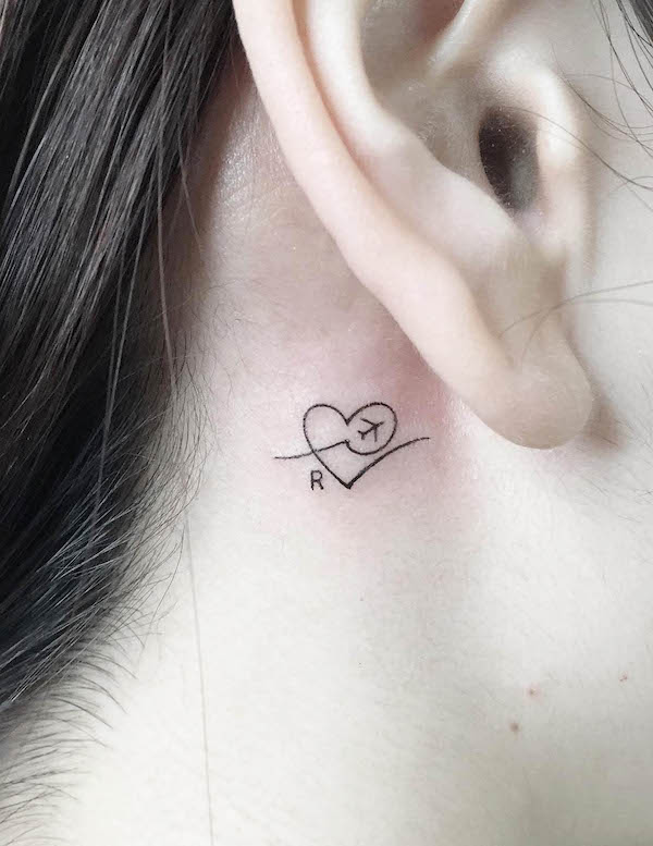 Heart and plane behind the ear tattoo by @playground_tat2