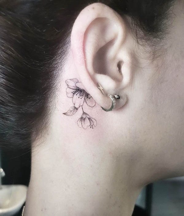 Flower behind the ear tattoo by @sailorstattoomilanomoscova