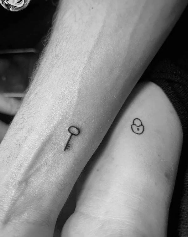 Tiny key and lock tattoos for couple by @rauschtattoo