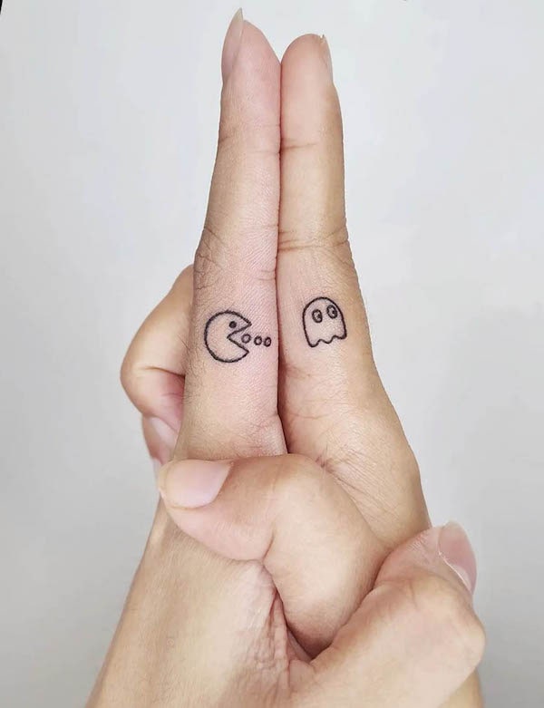 Tiny Pacman tattoos for couple by @inkgie_tattoo