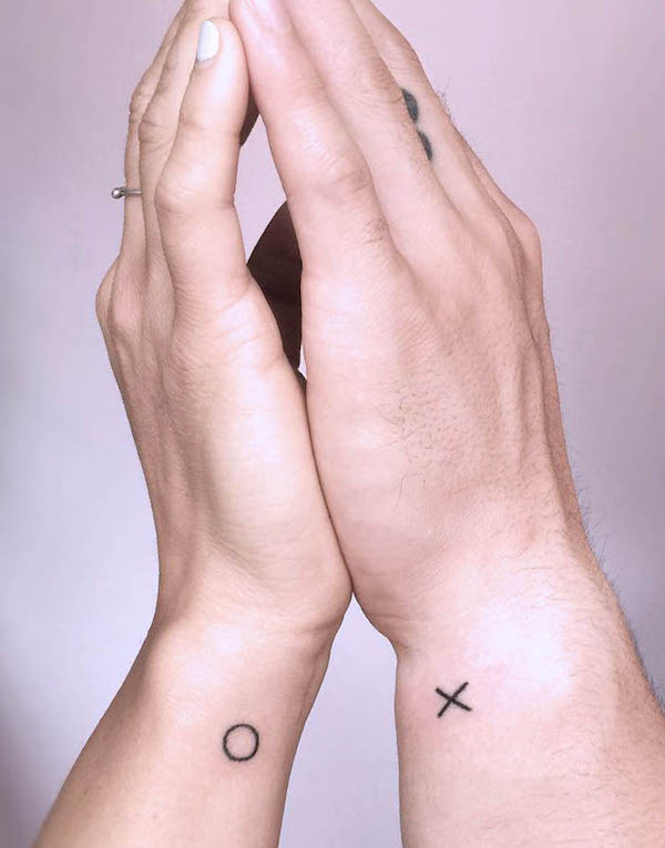 XO small wrist tattoos for couple by @kat3roo