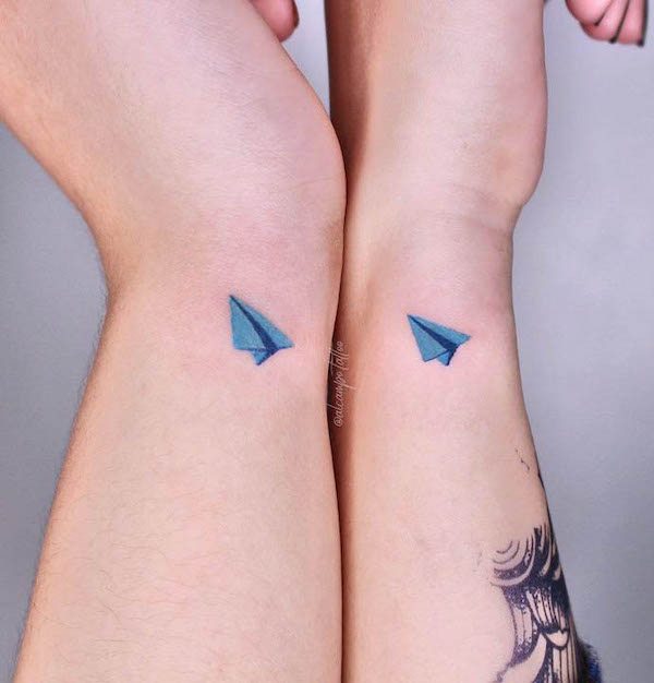 Cute paper plane tattoos for couple by @alcampo.tattoo