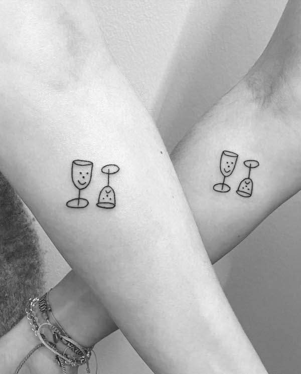 Cute small wine glass tattoos for couple by @doetanitattoer