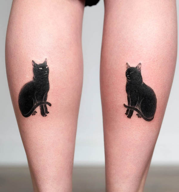 Black cat calf tattoos by @moon.cheon