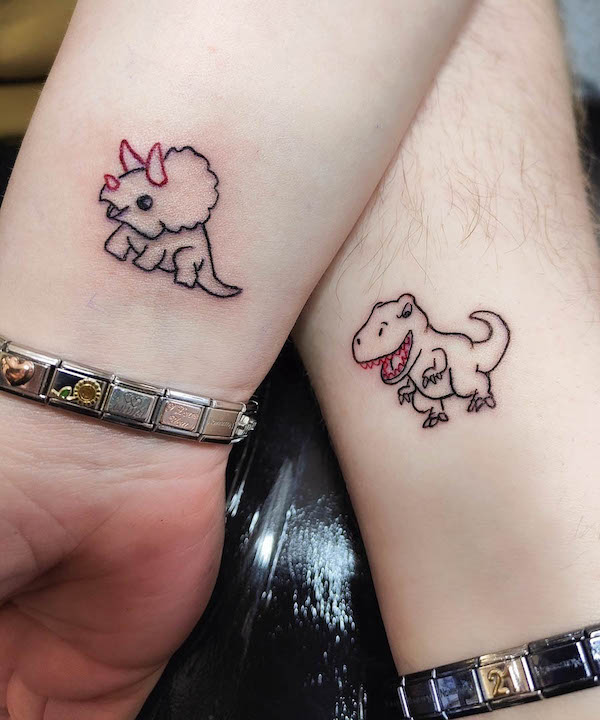 Matching dinosaur tattoos for couple by @asylumtattoo666