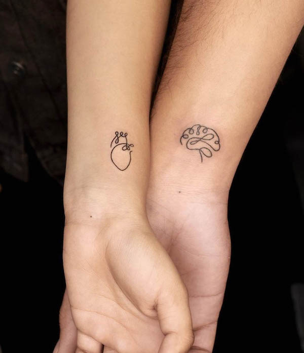 Heart and brain matching tattoos by @blue_heaven_tattooz