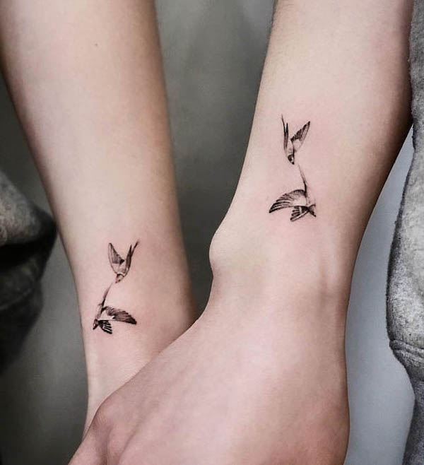 Matching bird tattoos for couple by  @tattooistbau