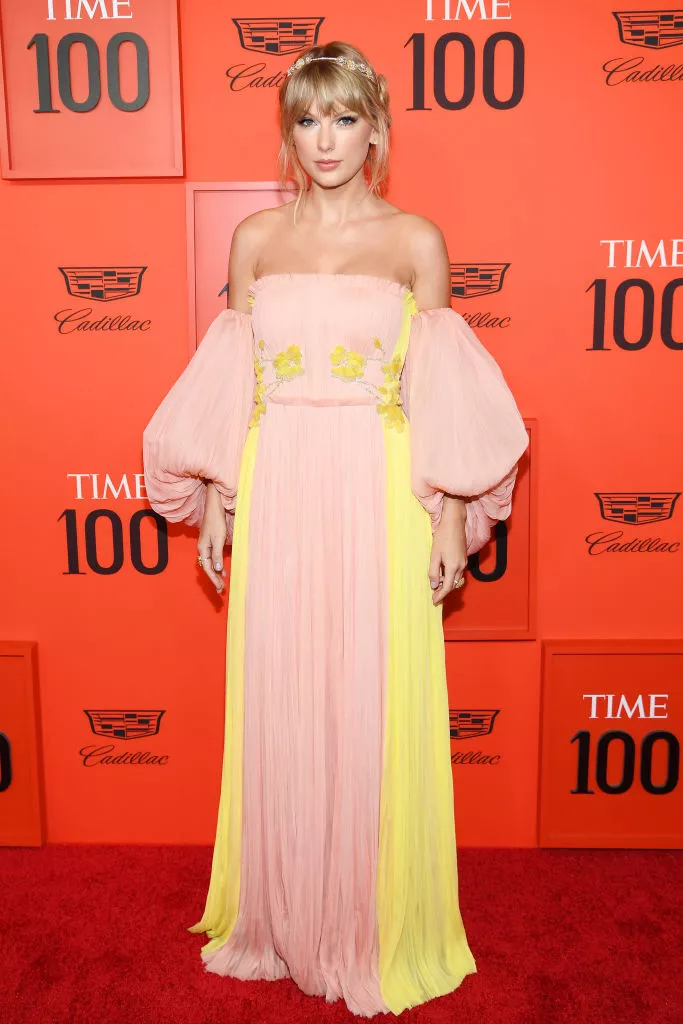 Taylor Swift wearing a sheer strapless blush and butter yellow gown at the TIME 100 Gala 2019