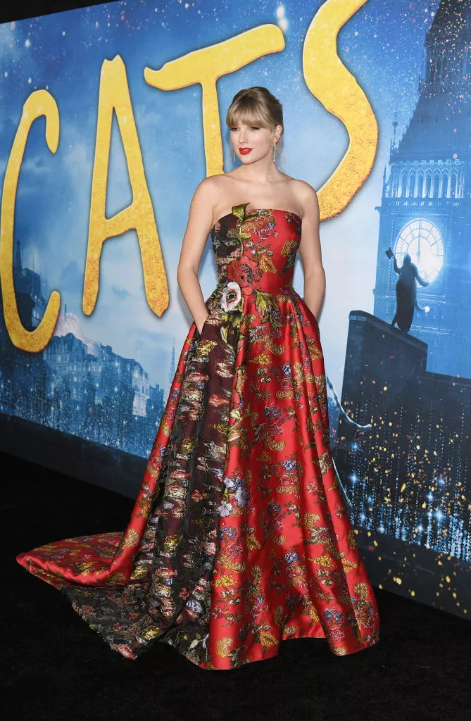 Taylor Swift in a red and black strapless gown at the world premiere of Cats