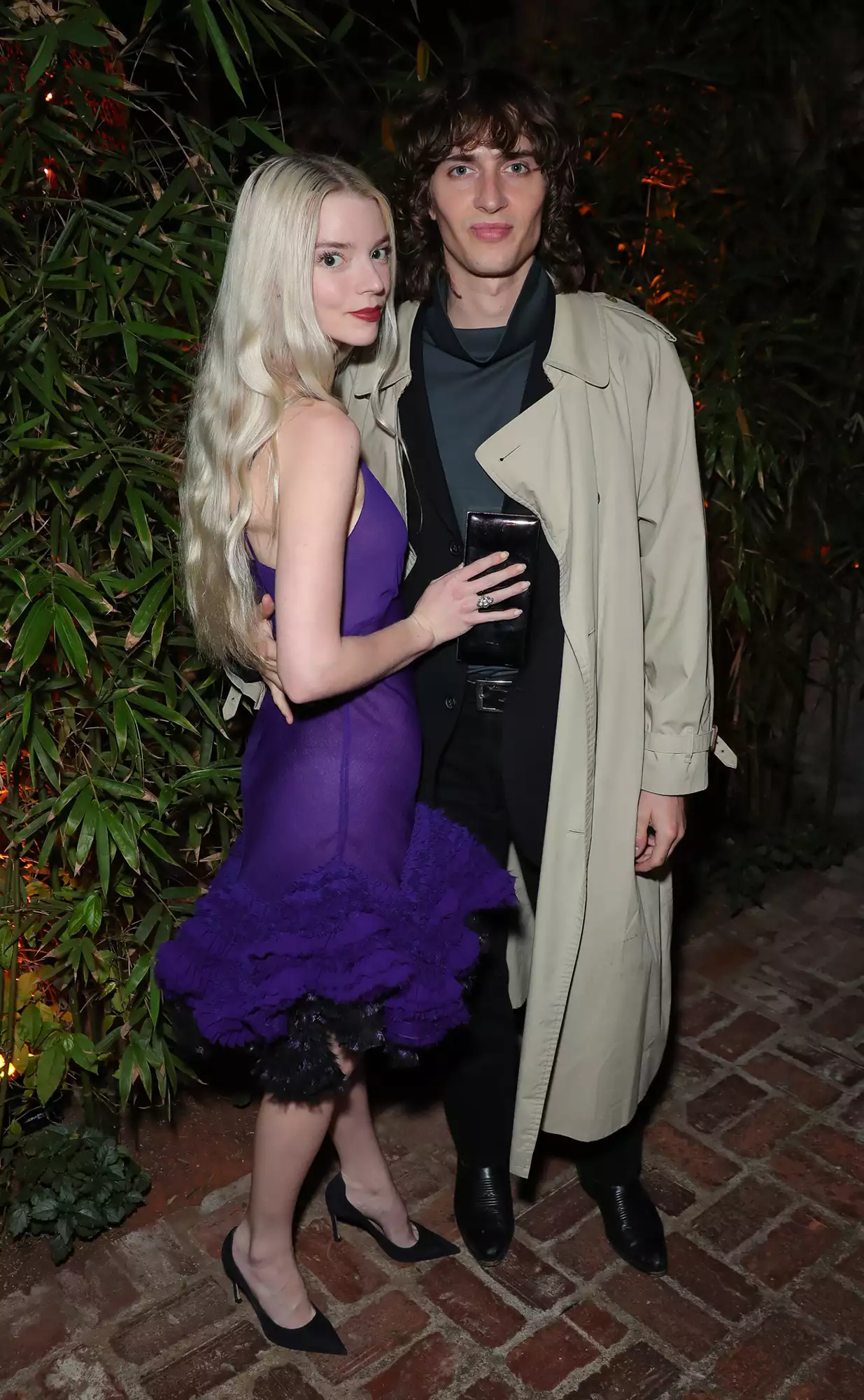 Anya Taylor-Joy and Malcolm McRae attend the CAA Pre-Oscar party at San Vicente Bungalows at San Vicente Bungalows on March 25, 2022 in West Hollywood, California