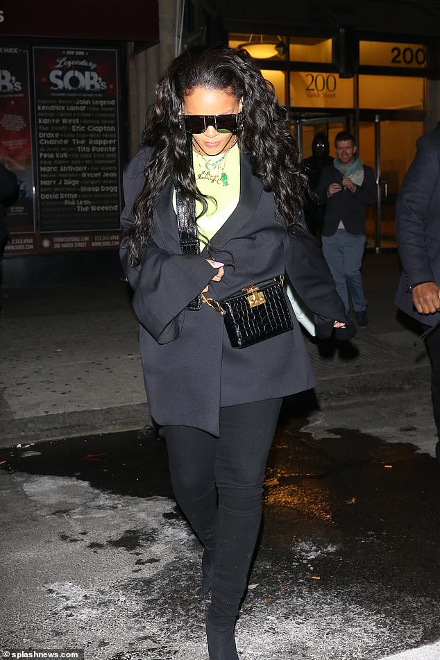 Keeping a low profile: Rihanna's look was more understated than her usual ensembles 