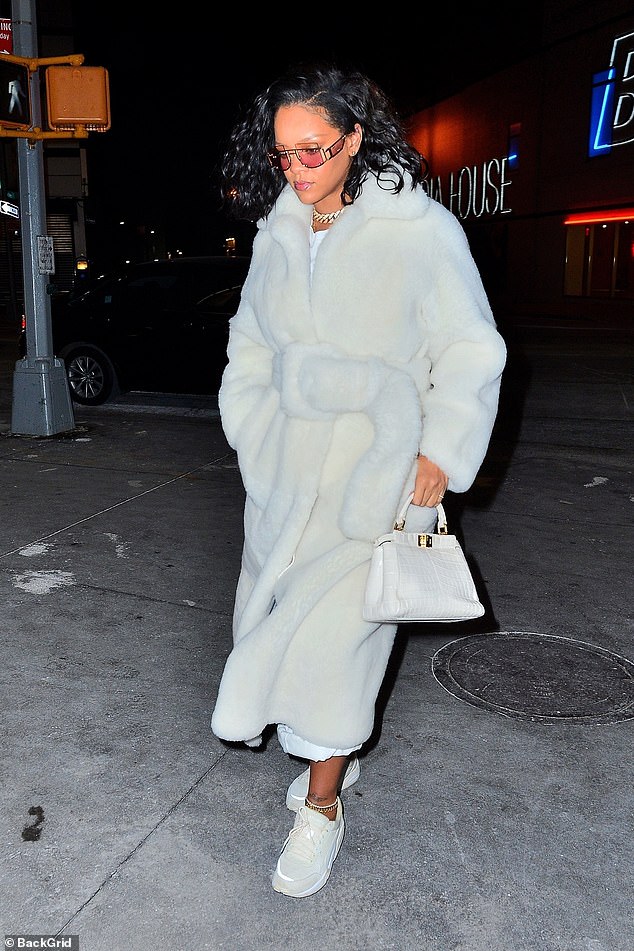 Outfit: The Bajan songstress, 30, turned heads in a flowing, bathrobe-inspired fur coat