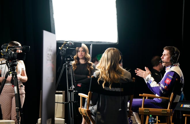 Denny Hamlin gives an interview during Media Day at Daytona International Speedway, Wednesday, Feb. 14, 2024.