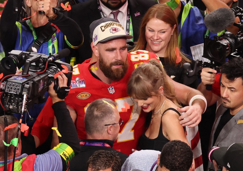 Travis Kelce holds smiling Taylor Swift after 2024 Super Bowl win