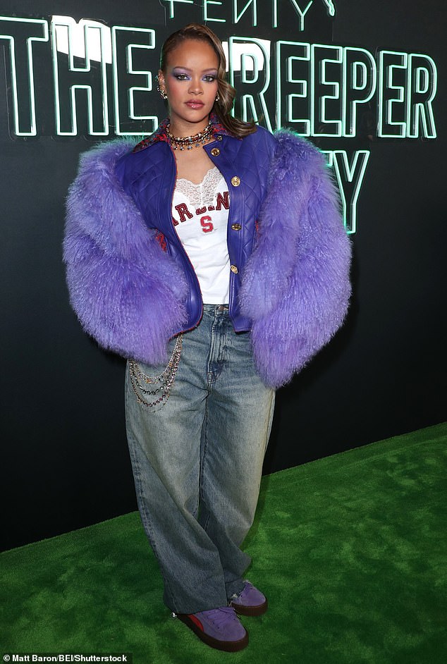 She added a pair of faded baggy jeans to her look, and embellished them with a multicolor stone chain on her hip