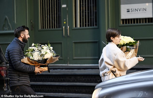 There was a continuous flow of flower deliveries as more people showed up with lavish bouquets of roses