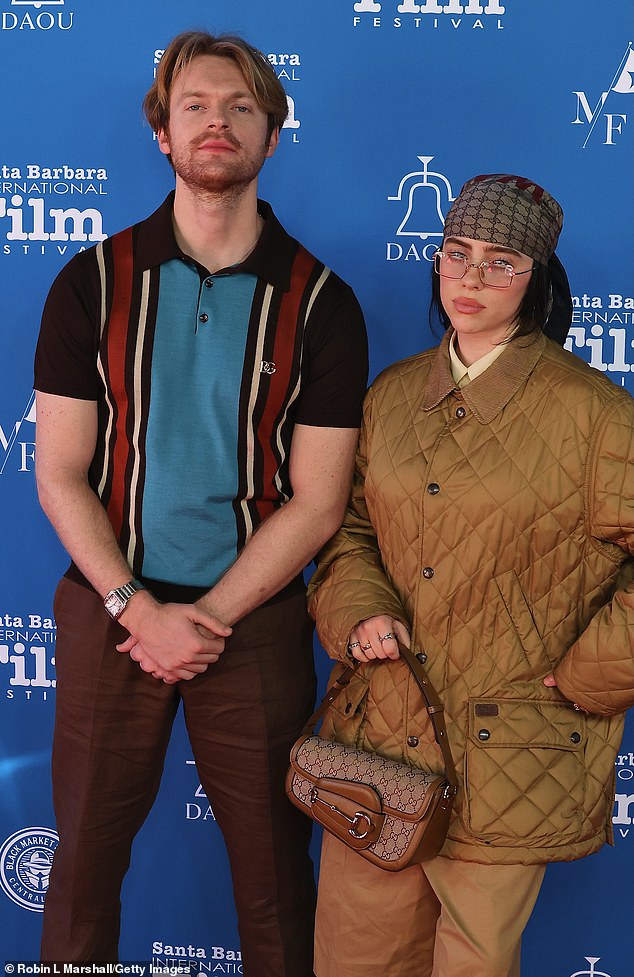 Eilish and the 10-time Grammy winner (L) - who were born and raised in LA's Highland Park - employ their parents Maggie Baird and Patrick O'Connell work as her personal assistant/fan-outreach coordinator and utility player