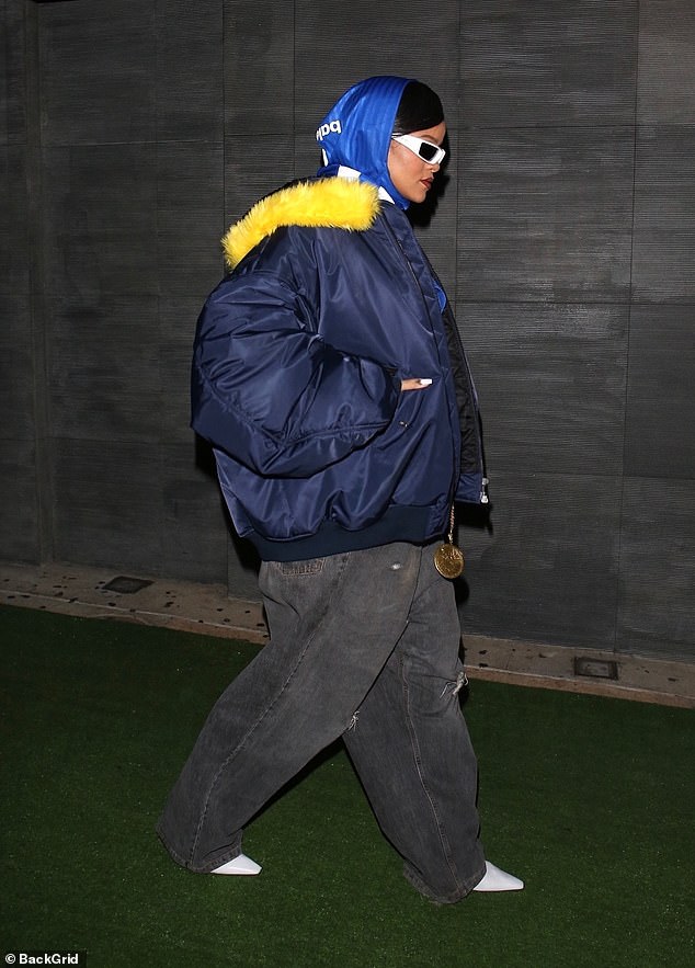 Strut: The star wrapped up in a blue jacket with yellow feathered trim