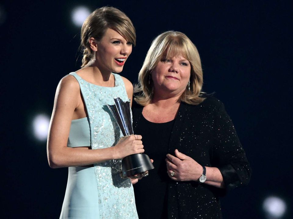 Taylor Swift receives the Milestone Award with her mother Andrea Swift