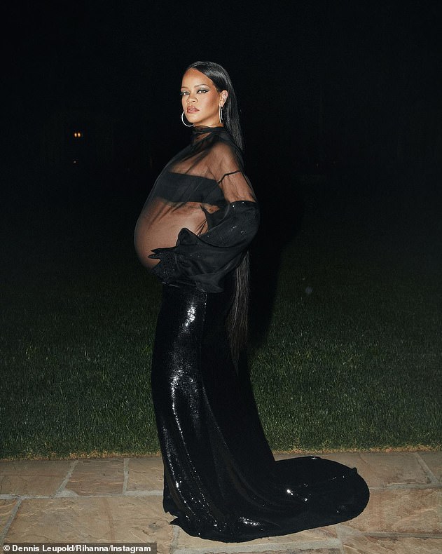 Back in black: She highlighted her cleavage in the outfit with a simple black bandeau, and she contrasted the revealing top half with a long black skirt covered in sparkling sequins