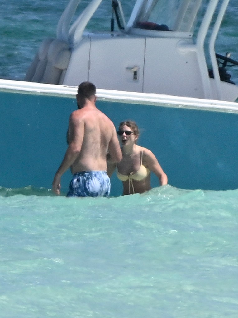 Taylor Swift and Travis Kelce in the ocean while on vacation on Harbour Island, Bahamas, Thursday, March 21, 2024.