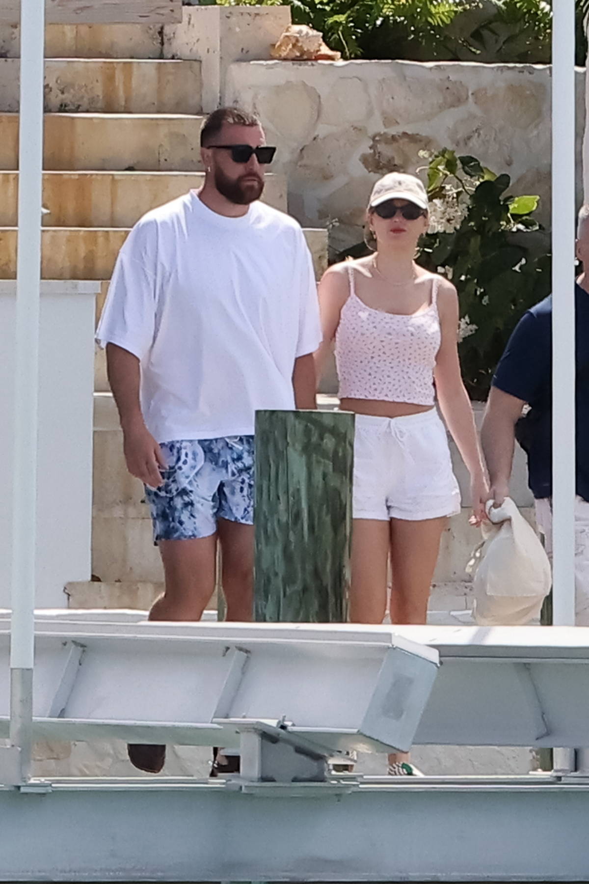 Taylor Swift looks great in a pink crop top and white shorts while enjoying  a romantic vacation with beau Travis Kelce in The Bahamas-200324_8