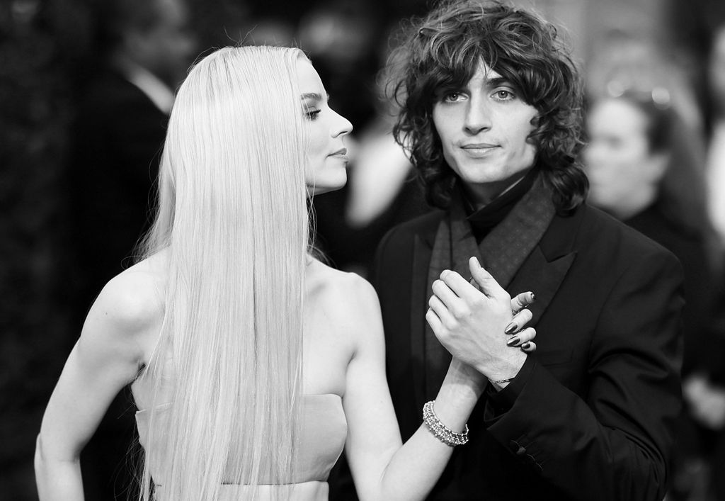 BEVERLY HILLS, CALIFORNIA - JANUARY 10: (EDITORS NOTE: Image has been converted to black and white. Color version is available.) (L-R) Anya Taylor-Joy and Malcolm McRae attend the 80th Annual Golden Globe Awards at The Beverly Hilton on January 10, 2023 in Beverly Hills, California. (Photo by Matt Winkelmeyer/FilmMagic)