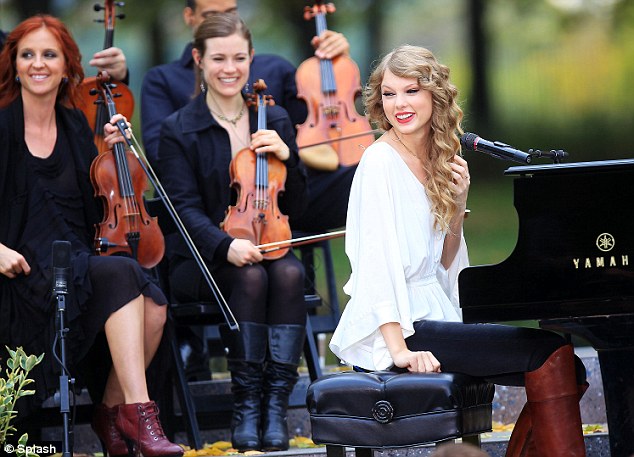 Taylor Swift performs with a small orchestra for fans in Central Park, NYC