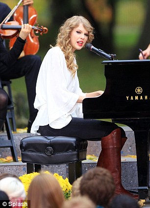 Taylor Swift performs with a small orchestra for fans in Central Park, NYC