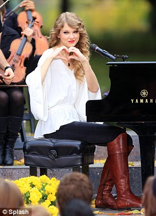 Taylor Swift performs with a small orchestra for fans in Central Park, NYC