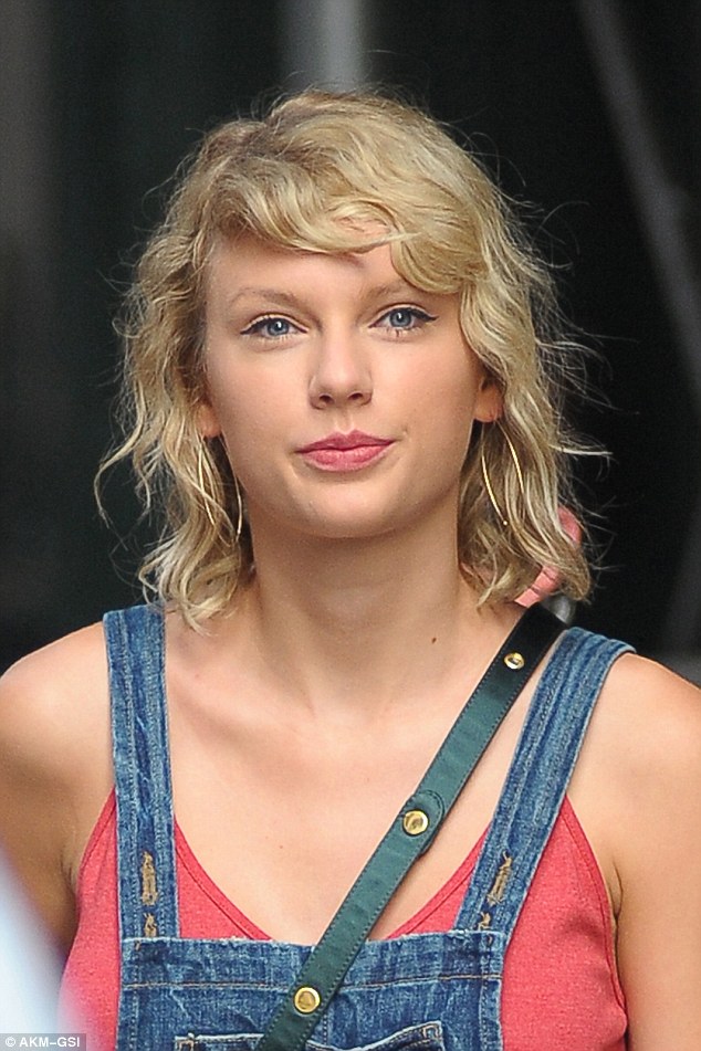 Curly girl: Taylor seemed to revert to her natural curls on Monday