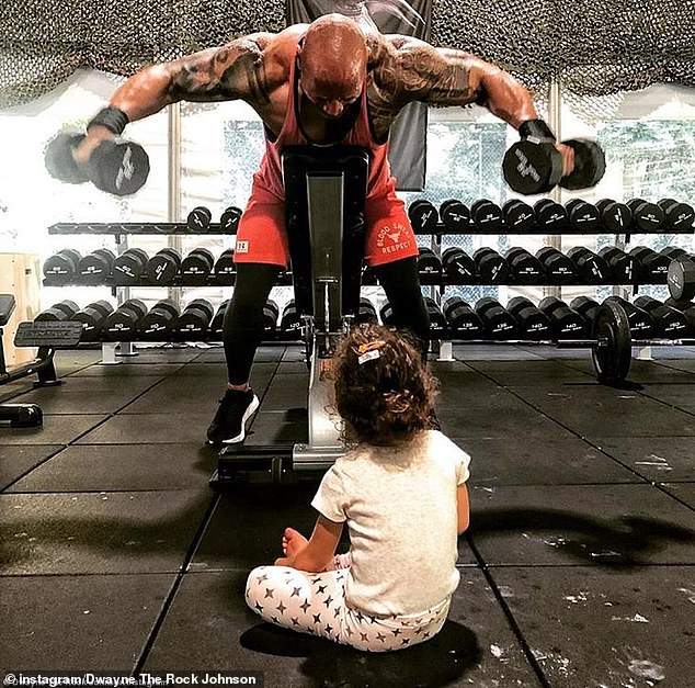 Working out in front of his daughter in his mobile gym, The Iron Paradise