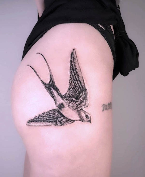 Detailed swallow hip tattoo by @zeayatattoo