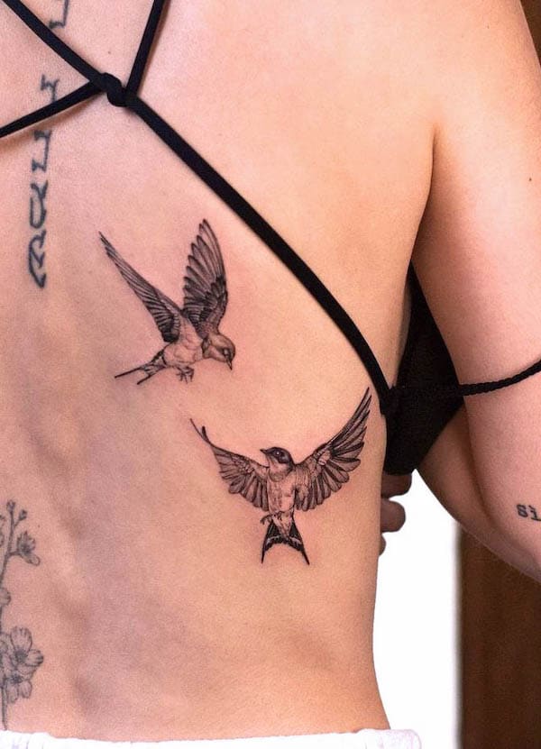 A pair of swallows for women by @vanya.ink