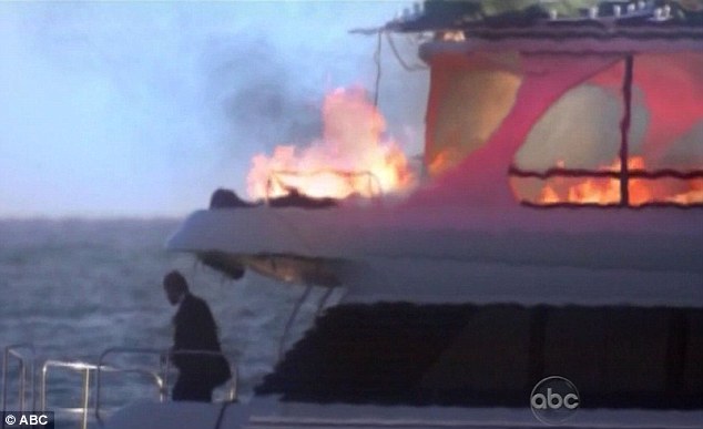 Oops! The firework appears to land on a luxury yacht out to shore where a wedding is taking place