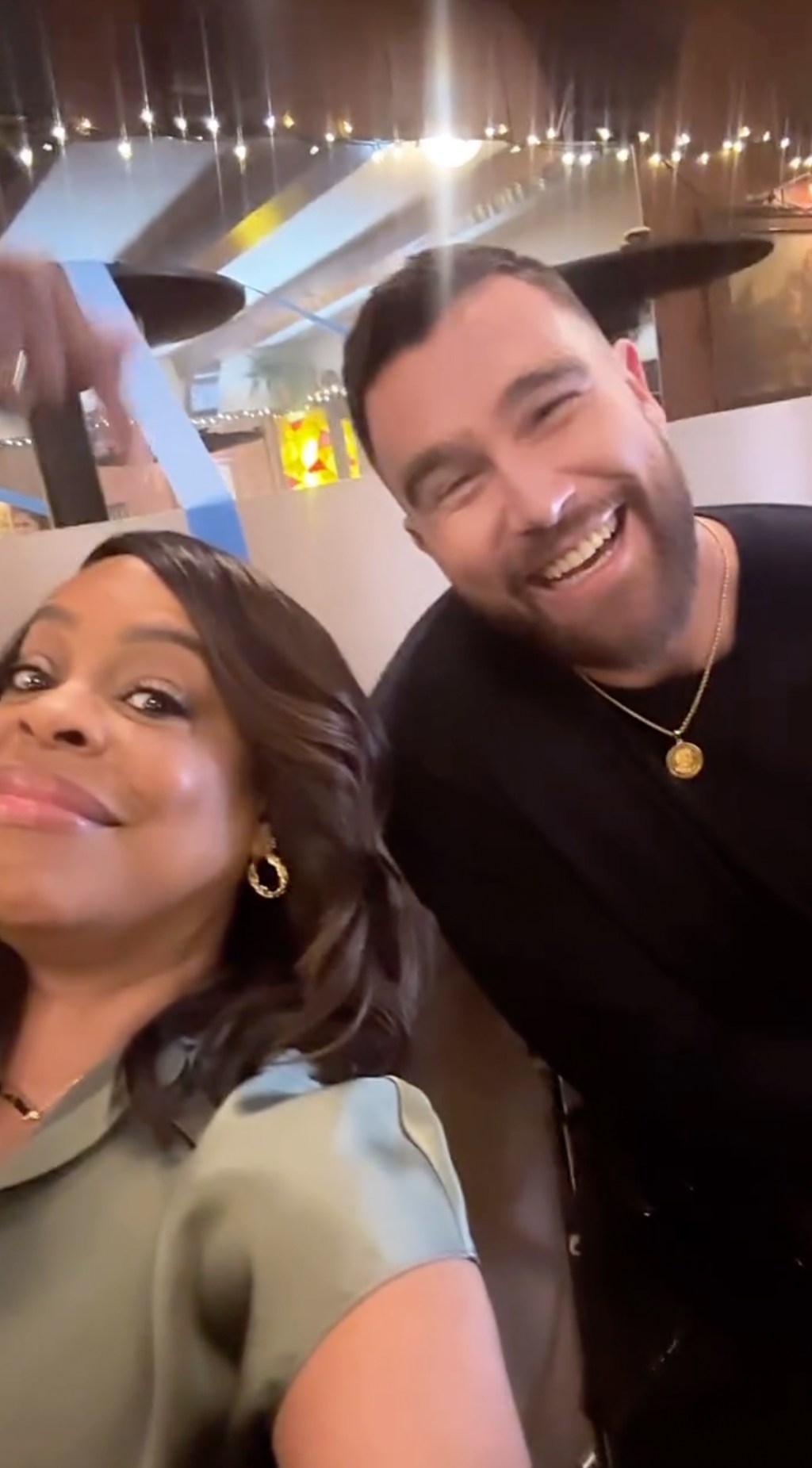 Travis Kelce and Niecy Nash.