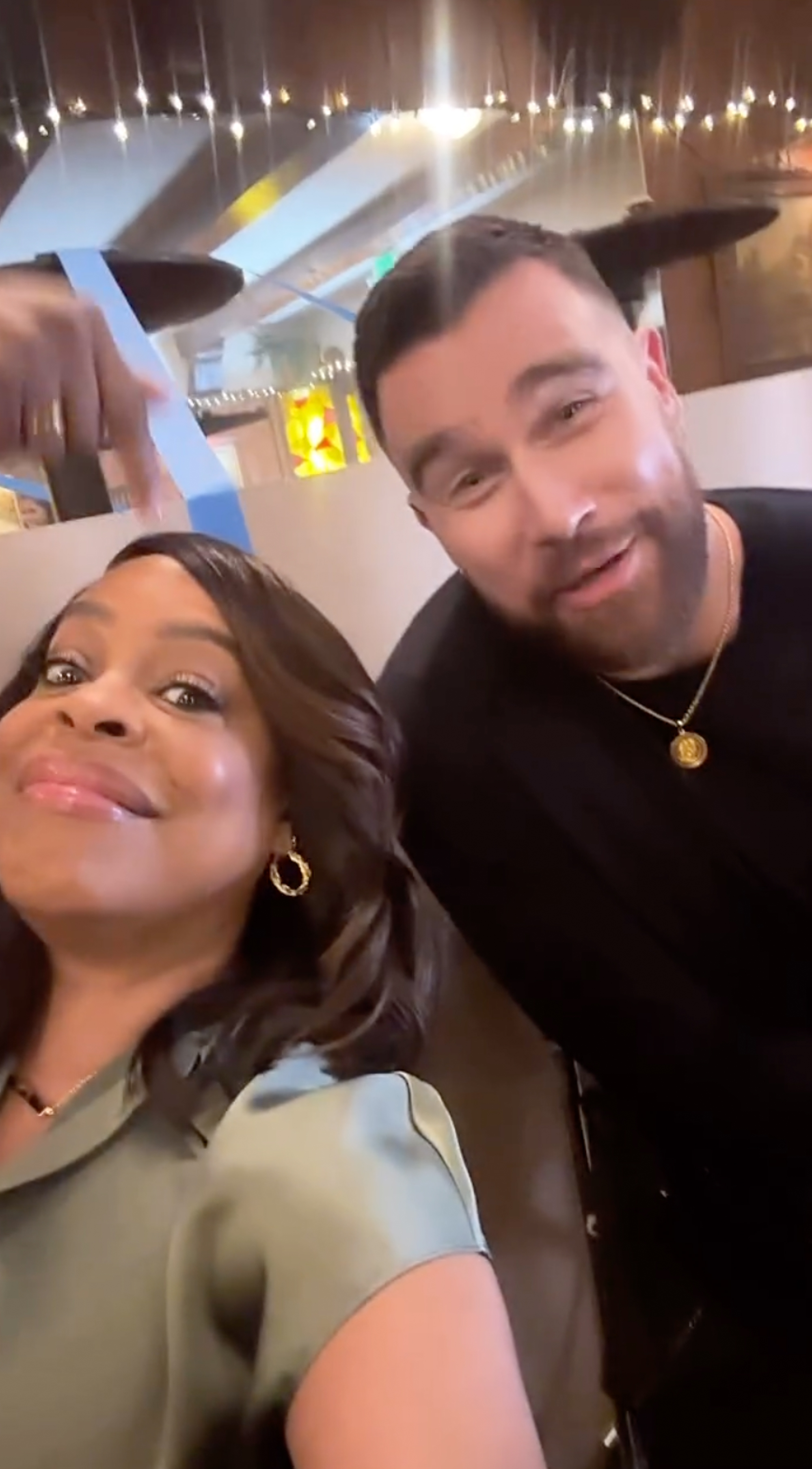 Travis Kelce and Niecy Nash.