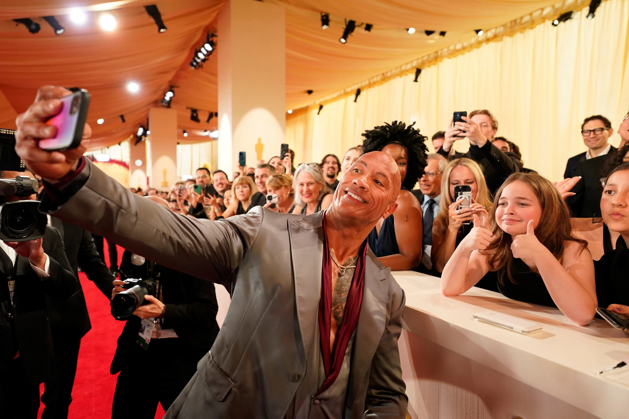 Outside of the ring, Dwayne Johnson is as much a fan of the people as ever, posing recently on the red carpet at the 96th Oscars.