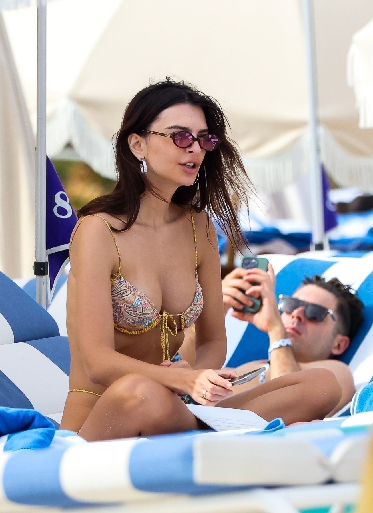 Emily Ratajkowski peels off her cover-up to reveal just her tiny thong  bikini on Miami Beach getaway | The Sun