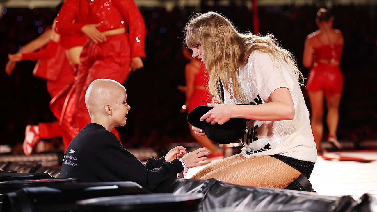 A young fan receives a hat from Taylor Swift during her performance at Accor Stadium on February 23, 2024 in Sydney, Australia.