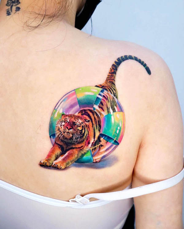 Cute tiger with a swimming ring tattoo by @non_lee_ink