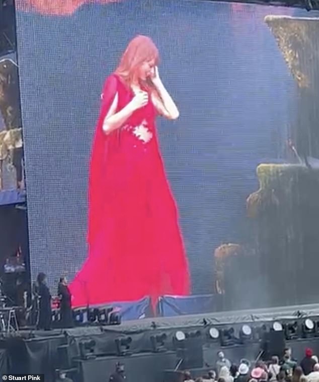 After performing the song, which she wrote with ex Joe on her 2020 album Evermore, the crowd chanted her name and Taylor removed her ear piece and so she could fully appreciate the moment